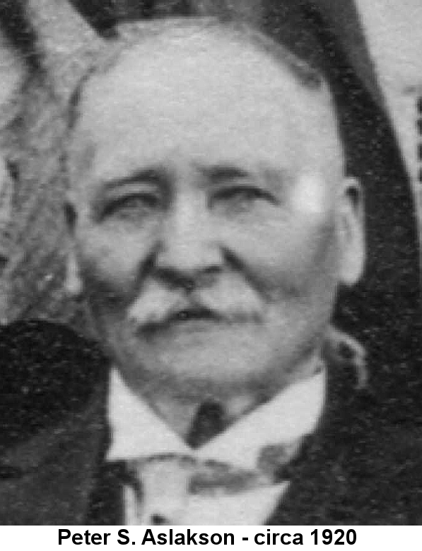 Black and white newspaper head shot of an elderly gentleman with thin close-cropped grey hair, prominent cheekbones, and thick white moustace wearing a wing collar and dark jacket.